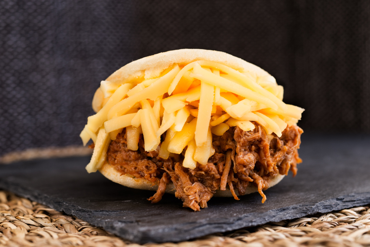 Arepa with mechada meat and cheese